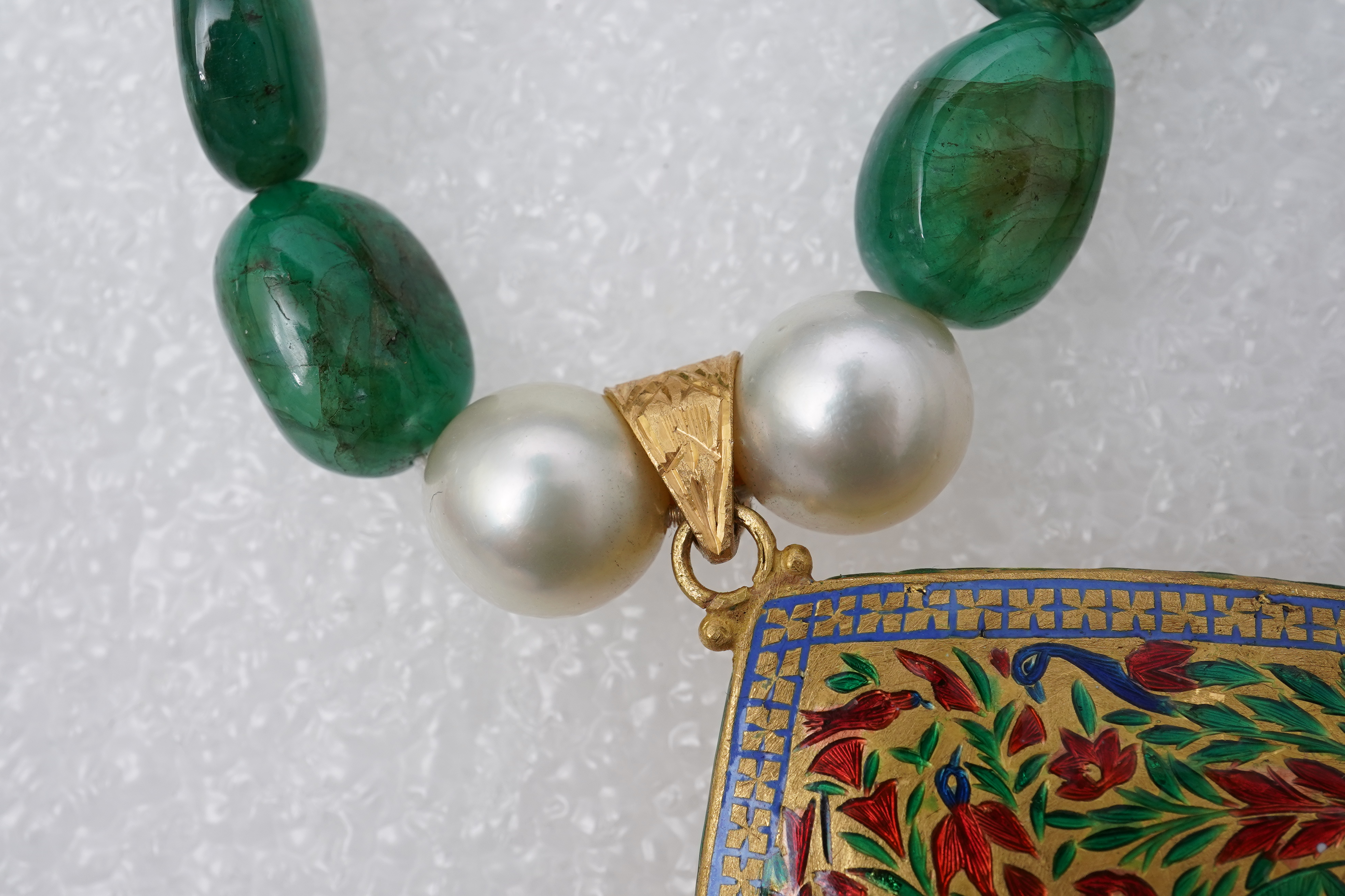 An emerald, ruby, enamel, cultured pearl and diamond demi-parure, India